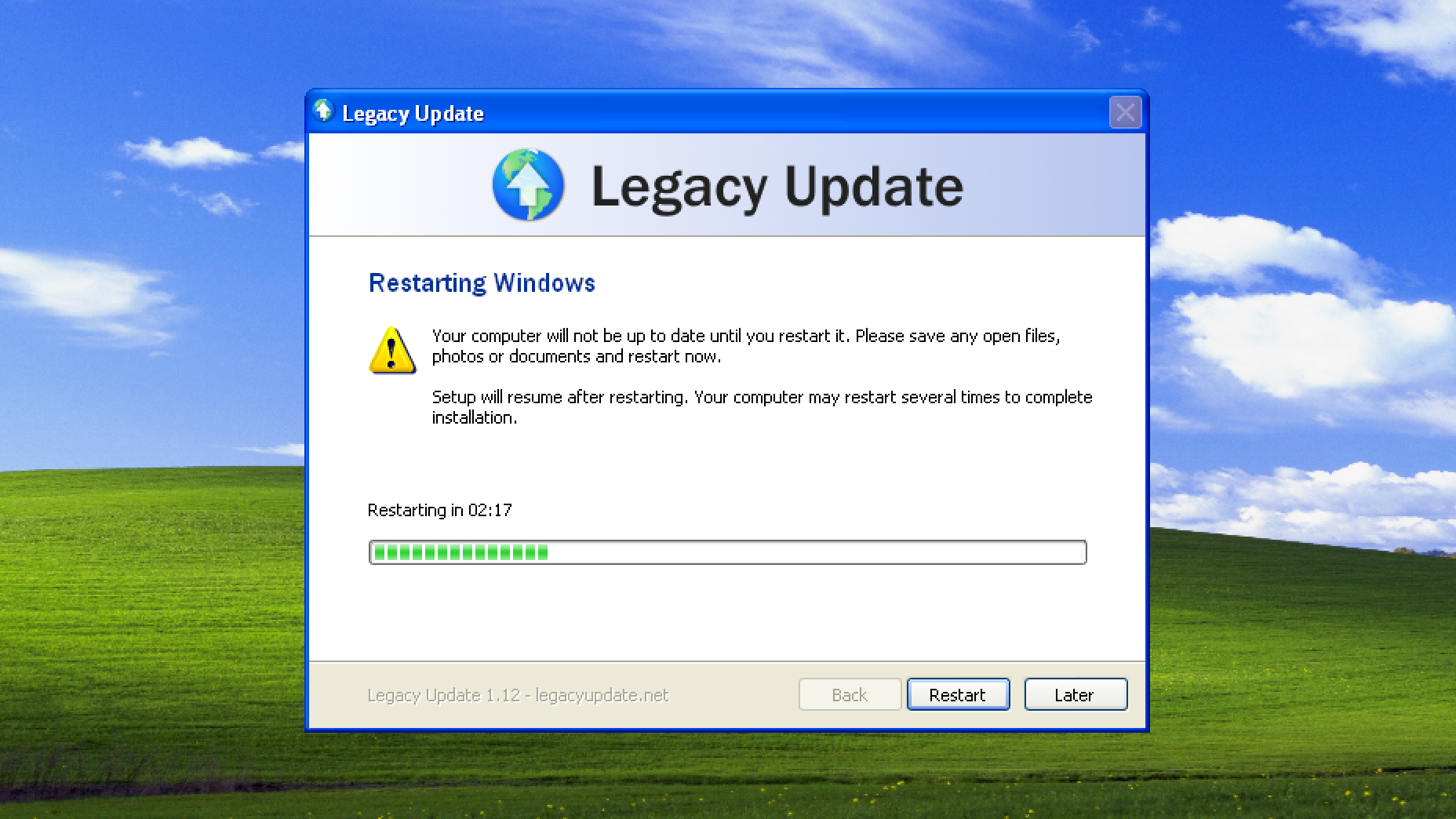 Legacy Update setup dialog says: Restarting Windows. Your computer will not be up to date until you restart it. Please save any open files, photos or documents and restart now. Setup will resume after restarting. Your computer may restart several times to complete installation. Restarting in 02:17